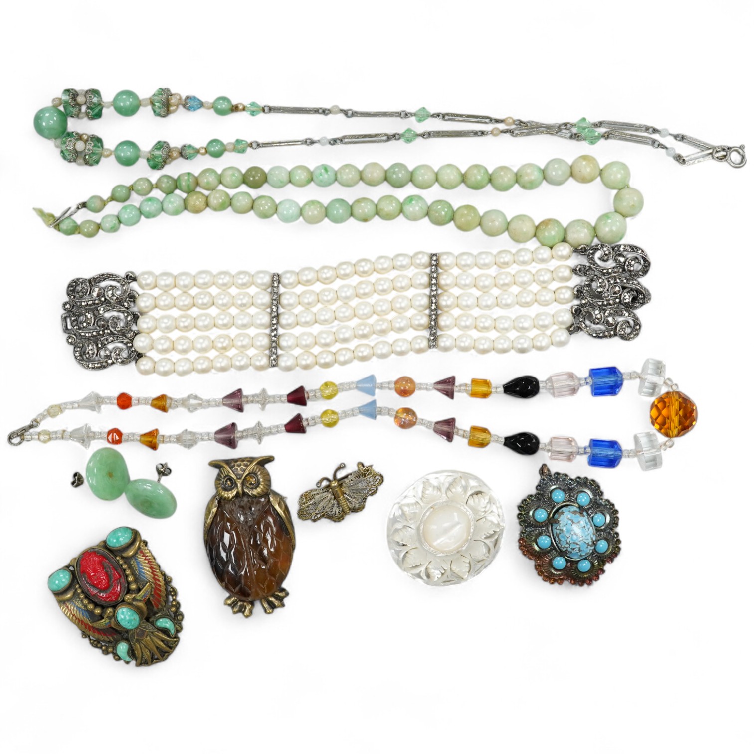 A simulated pearl bracelet and other jewellery including earrings, brooches, jade necklace, etc.